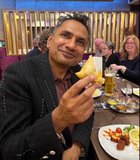 Raja Miah nibbling a samosa 2