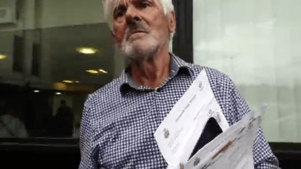 Warren Bates holding his three ASBOs